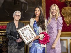 Isabelle Pennington-Edmead being presented with her award by actress Sienna Miller (right) and Kings Foundation trustee Dame Susan Bruce